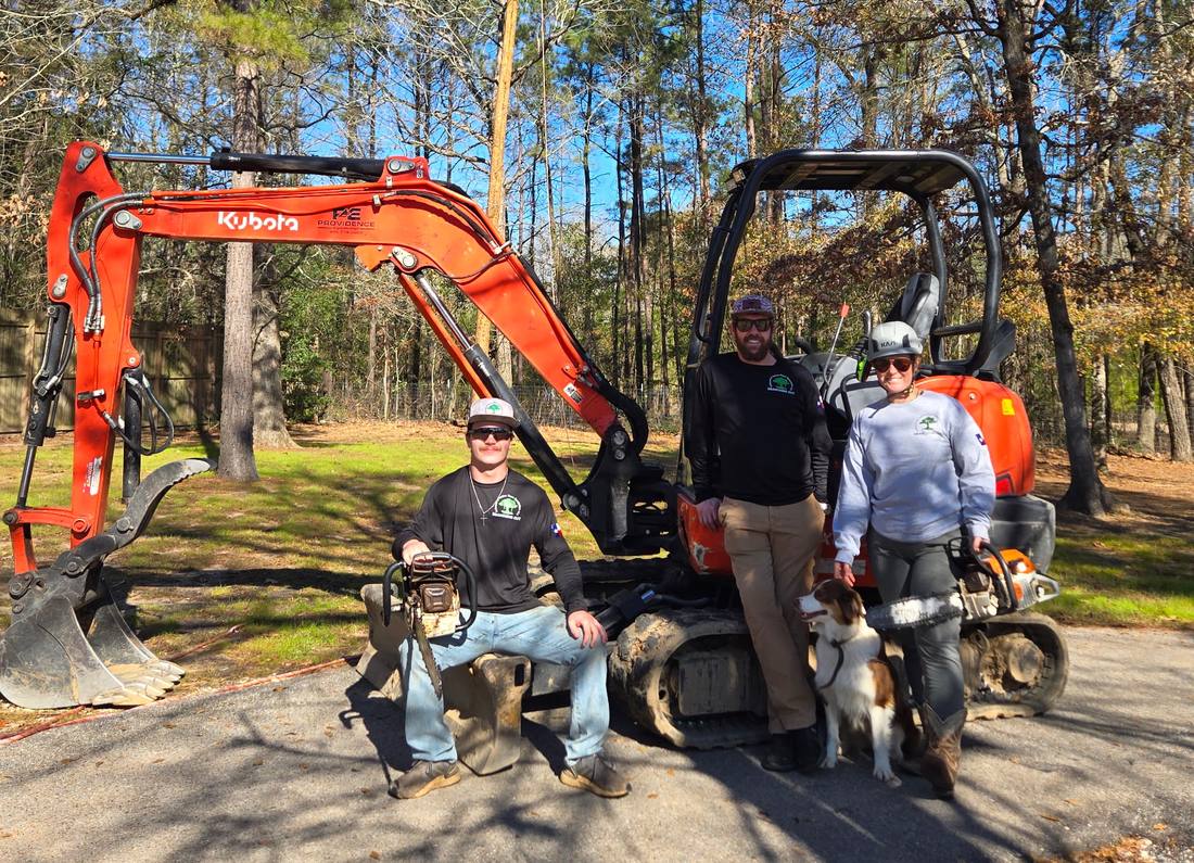 The Branching Out crew with their tracked excavators on a wooded East Texas property